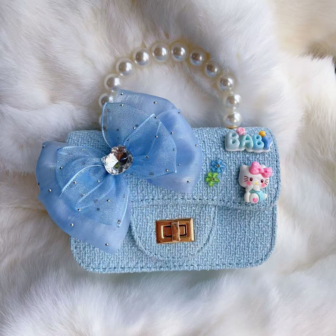 Nuevo tipo de bolsos para niños, bolsos de moda, bolsos de princesa de viento, bolsos portátiles lindos para chicas, bolsos de red para bebés.