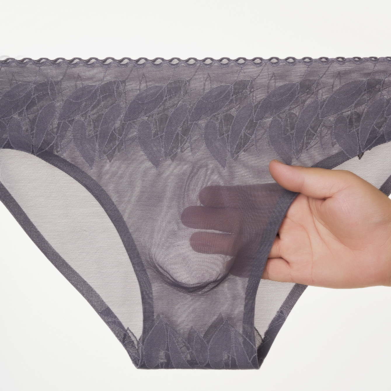 Nuevas calzoncillos de hombre elásticos de encaje 3D bolsas convexas estereoscópicas calzoncillos de hombre sin marcas