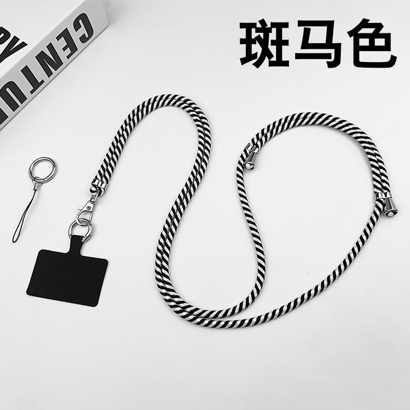 携帯電話のストラップの首が斜めにまたがっています。|undefined