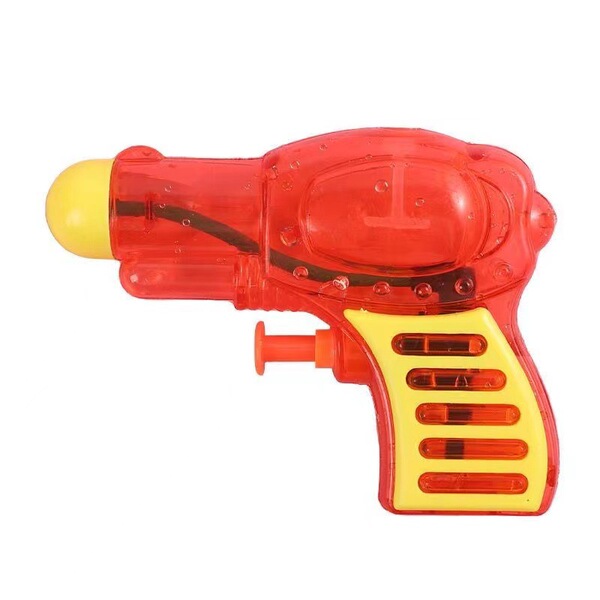 Summer beach travel water gun play in water