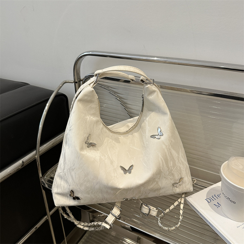 Mochila de viajes de gran capacidad para mujeres 2024 nueva moda mariposa brazo bolso de hombro bolso de cadena universal
