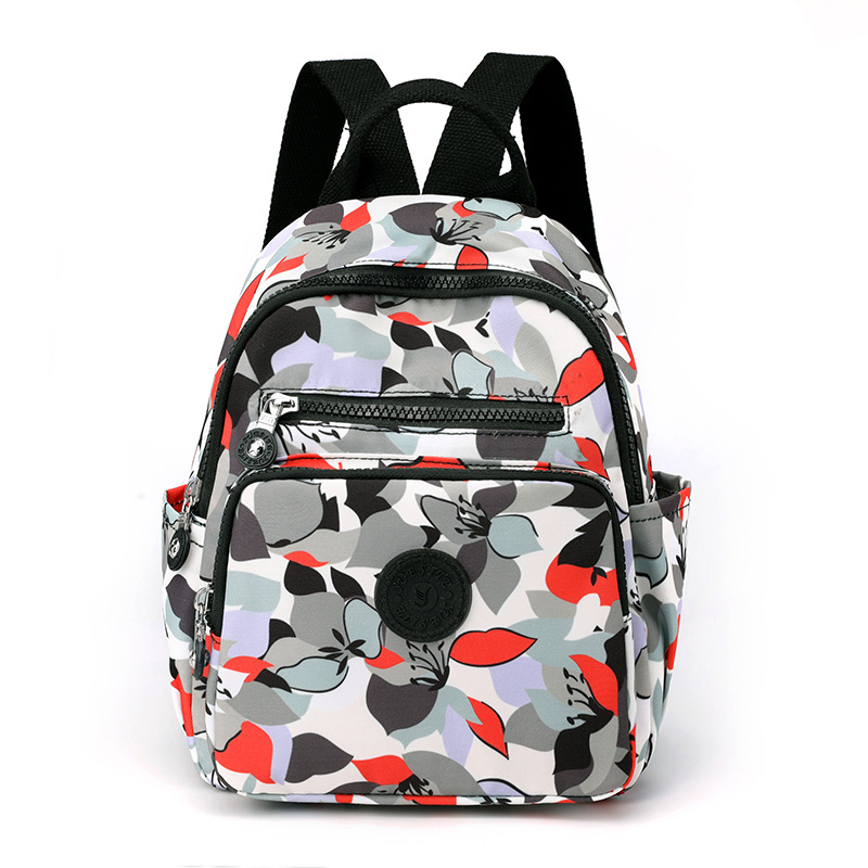 Nuevo estilo coreano mochila de mujer de moda de mediana edad y anciano madre viaje pequeña mochila de nylon mochila casual al por mayor