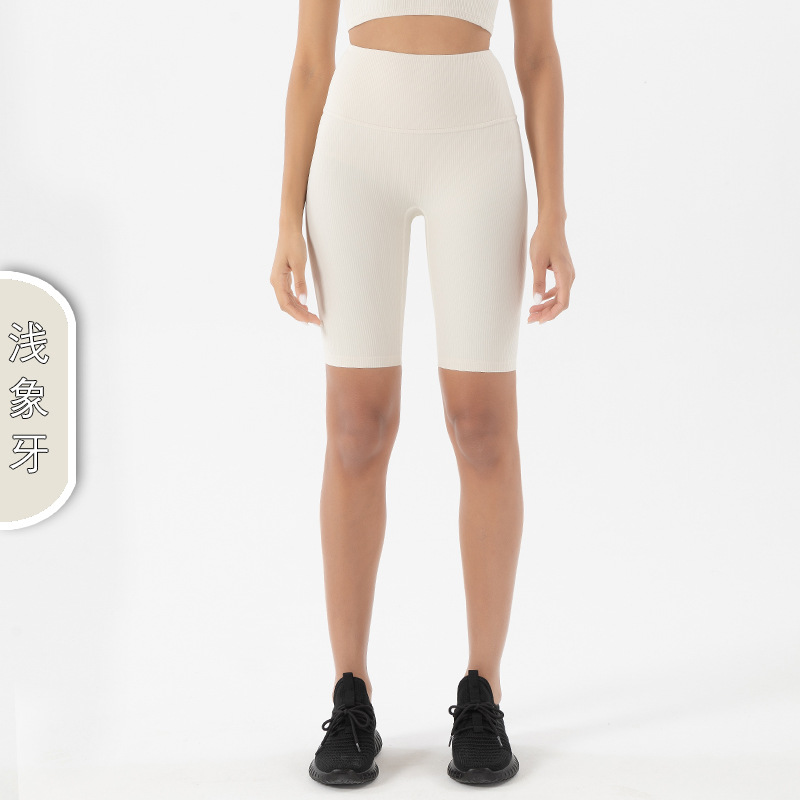 Nuevos shorts de yoga acanalados sin costuras de estilo europeo y americano para mujer, de cintura alta, efecto levanta glúteos, shorts deportivos de cinco puntos.