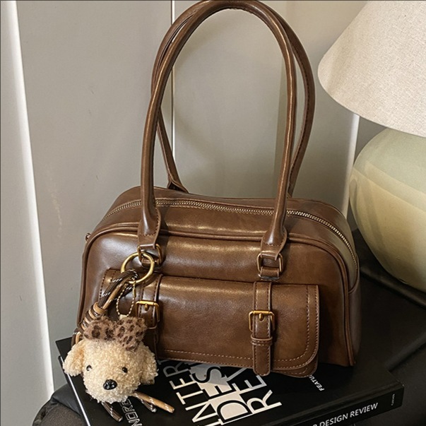 Bolsa de bolos de mano de moda coreana para mujeres 2025 nueva bolsa de almohada casual universal bolsas de hombro para viajar bolsas de brazo