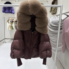 2025 冬の新ミッドレングスヨーロッパスタイルの真の大きな毛皮の襟フード付きダウンジャケット女性の厚く暖かいニットスリーブジャケット女性