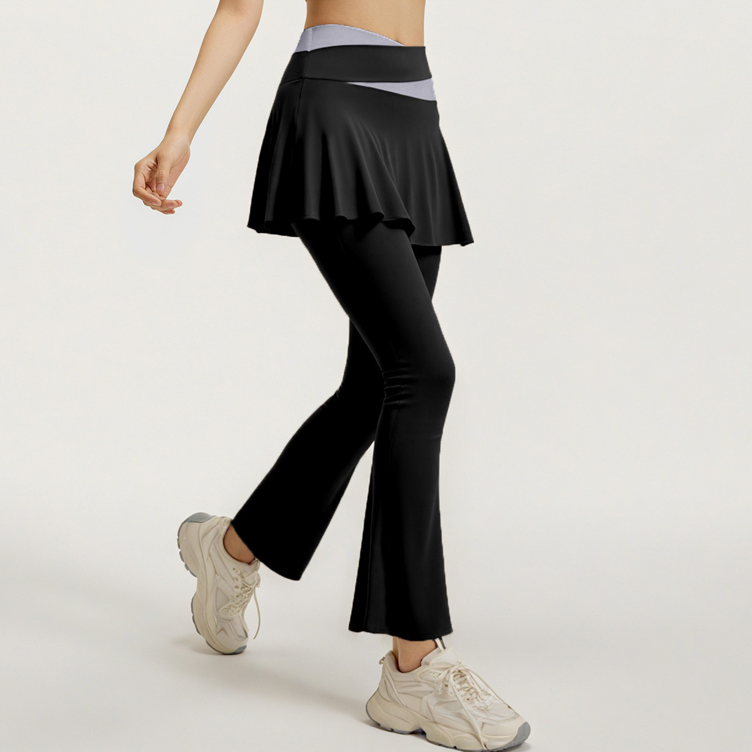 Los nuevos pantalones de falda de cuerno a juego de color de Juyitang son elásticos y delgados, falsos dos pantalones de yoga para correr de cintura alta