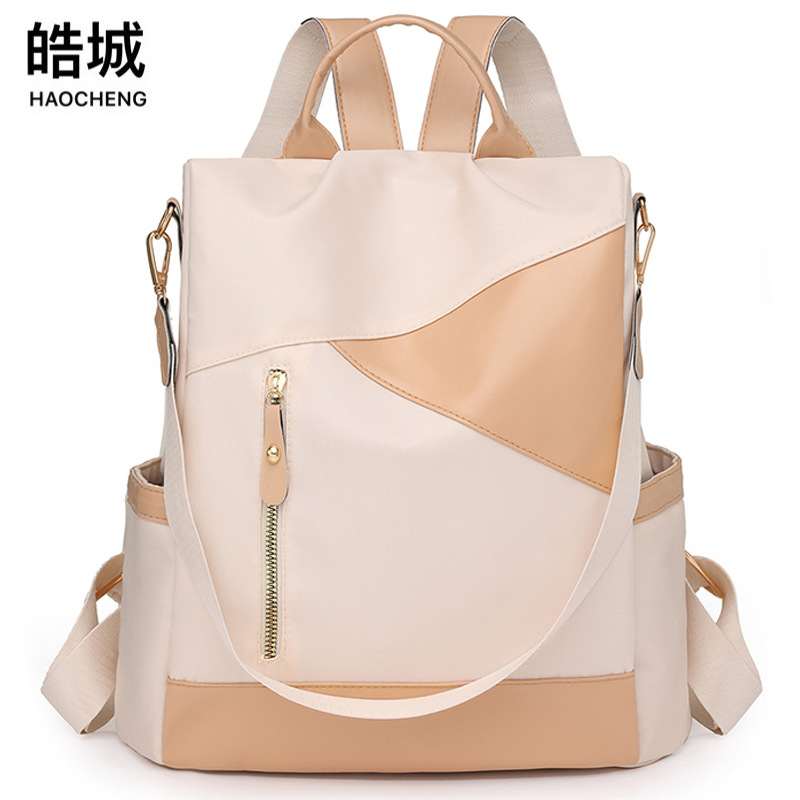 2024 nueva moda moda contraste color damas mochila antirrobo simple y versátil mochila de viaje al aire libre al por mayor