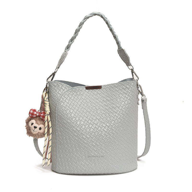 Bolso de moda bolso de axila de gran capacidad 2025 nuevo bolso de hombro de tendencia bolso de mensajero de todo fósforo bolso de cubo de color sólido