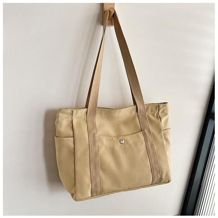 Wholesale of new women's single-shoulder bags, cross-border simple and casual canvas bags, Korean version LOGO printed commuter tote bags undefined