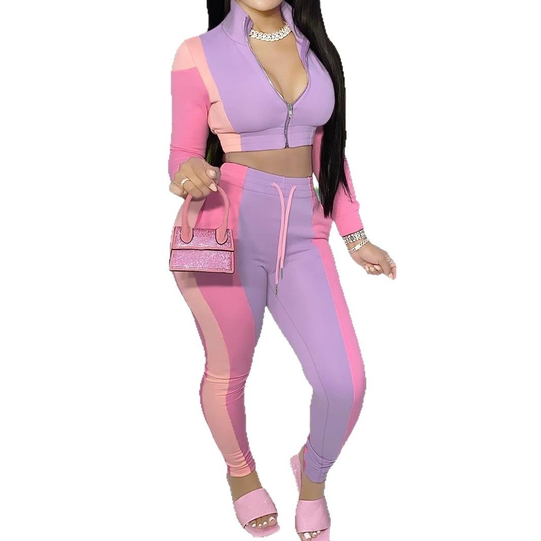 Completo da donna a due pezzi con blocchi di colore: giacca sportiva con cerniera e pantaloni casual, ideale per primavera e autunno._voghion.com