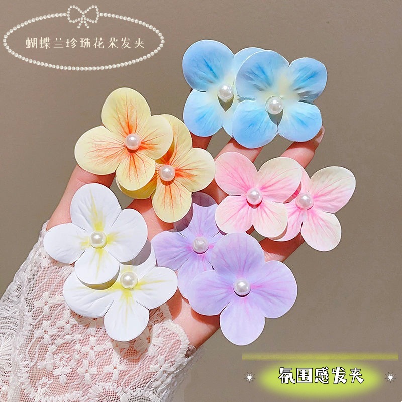 Orquídea de mariposa flores de perlas clip de pelo de vacaciones mar de viento lateral clip de boca de pato super inmortal flores simuladas adornamientos de pelo al por mayor image 1