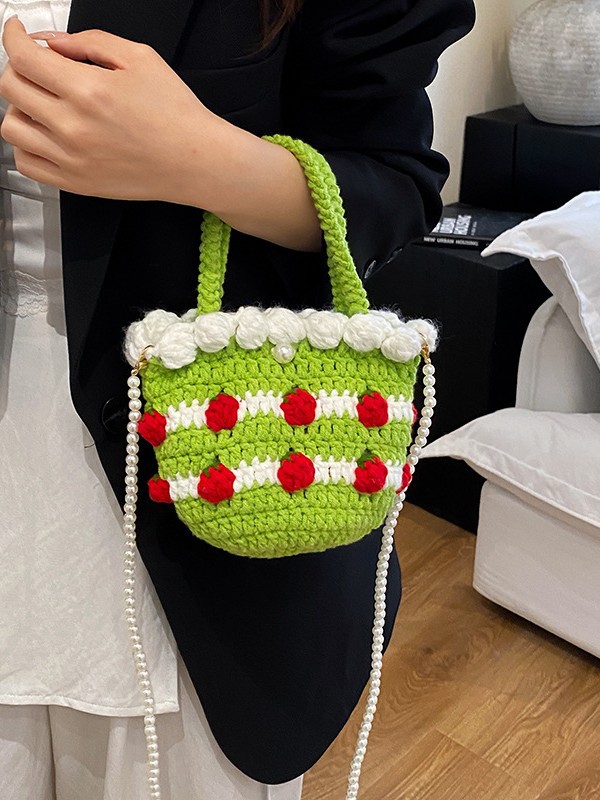 Bolso de mensajero de nicho de dopamina femenino 2025 nuevo bolso de fresa bolso tejido de vacaciones bolso de cubo bolso transfronterizo