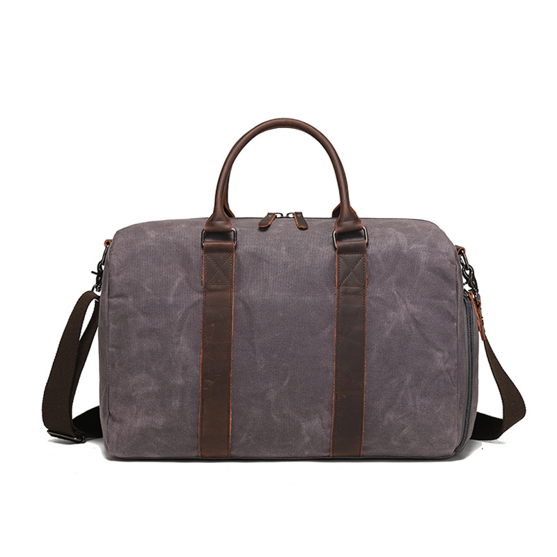 Nueva bolsa de viaje de tela de cera de aceite resistente al desgaste retro europea y americana color sólido bolsa de hombro al aire libre bolsa de almacenamiento al por mayor