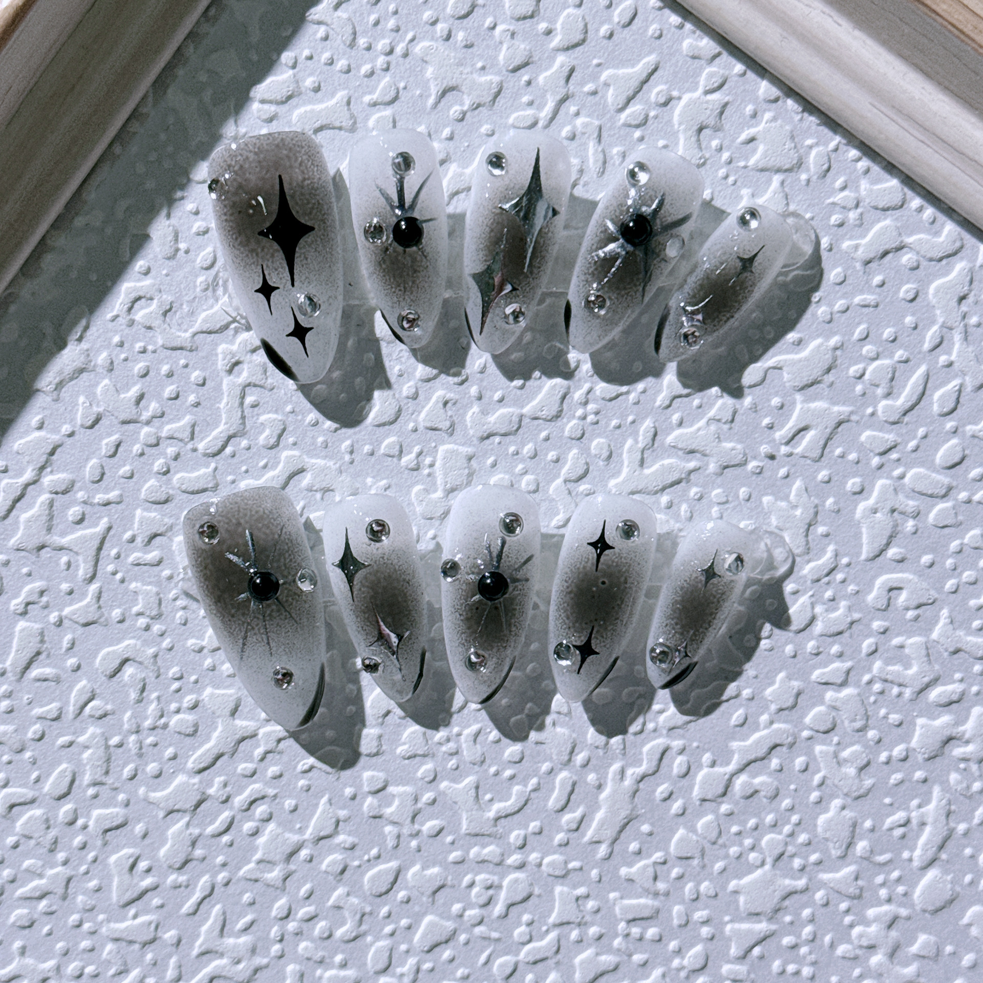 Use uñas sensación de frío plata estrellas caliente manicura chica