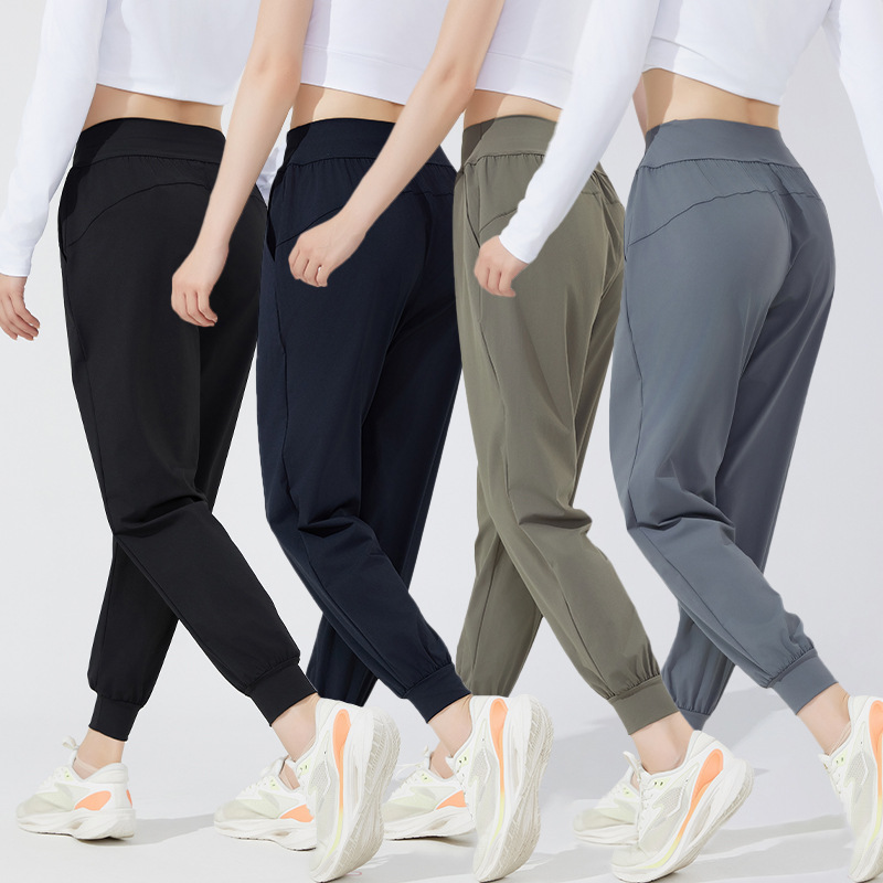 Pantalones deportivos casuales elásticos y transpirables estilo otoño 2026 para mujer, ideales para yoga, correr y fitness al aire libre.