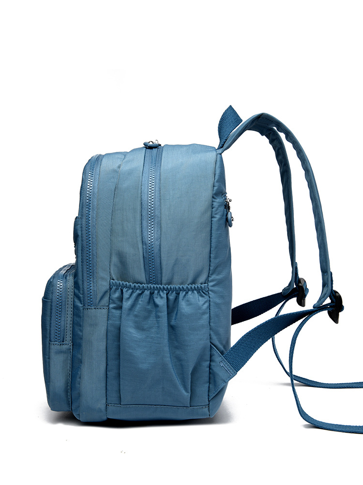 Mochila de hombro de comercio exterior 2025, nueva mochila de computadora simple de color sólido, mochila de escuela secundaria, mochila para hombres y mujeres.