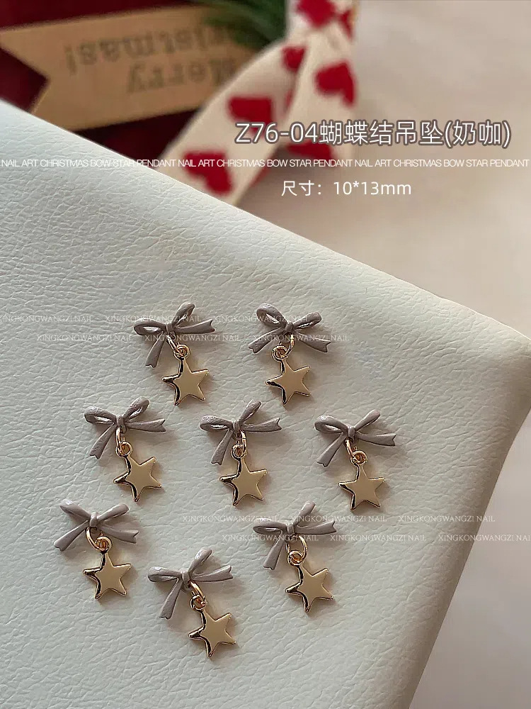 Navidad arco joyas de manicura otoño y invierno nuevo tipo de alta protección de color pentagonal aleación colgante tridimensional accesorios de uñas