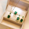 New temperament emerald green pendant titanium steel necklace three-piece set micro-set zircon earrings high-end light luxury ring