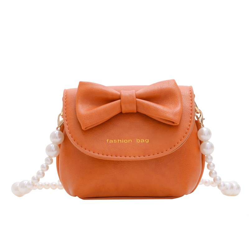 Cute mini niñas bolso de hombro dulce perla bolso de bebé coreano nuevo bolso de cambio de color sólido para niños