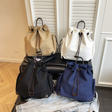 大容量帆布手提水桶包包新款收纳通勤双肩包外出旅行学生上课书包