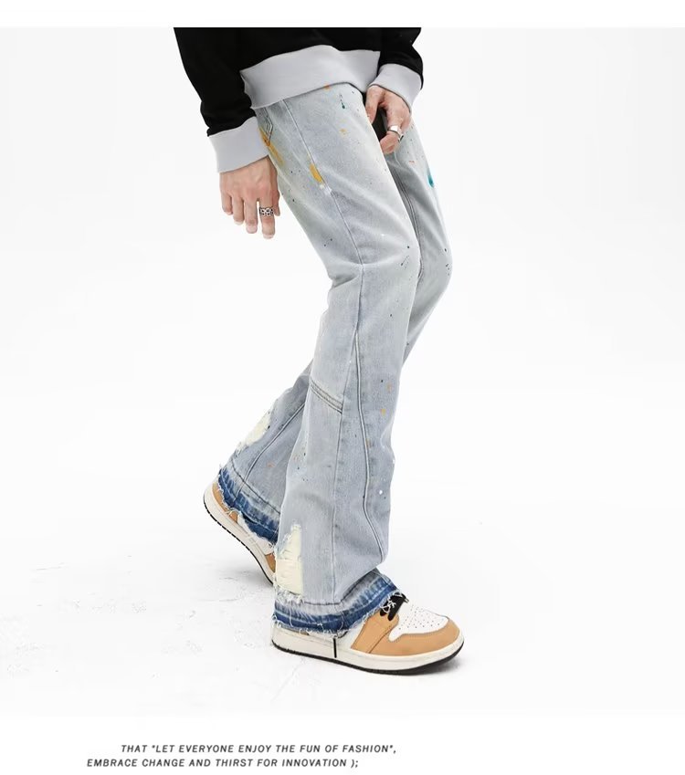 Jeans uomo slim fit stretch con strappi e taglio micro flare_voghion.com