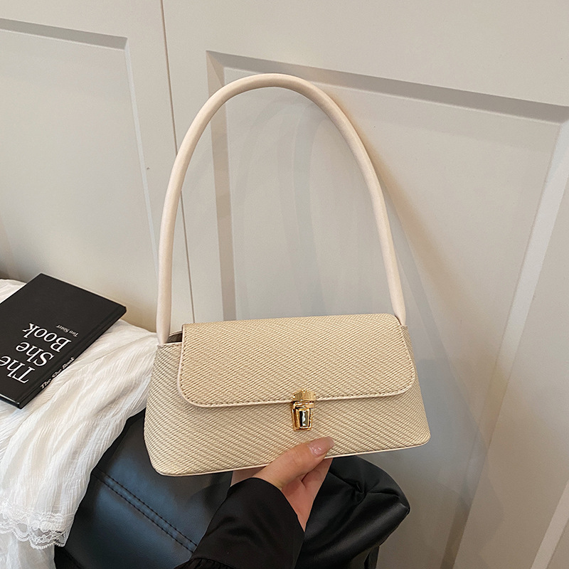 Bolsos de diseño de nicho de ocio para mujer 2025 nuevo bolso de axila de un solo hombro de moda de primavera bolso de palo de mano de moda