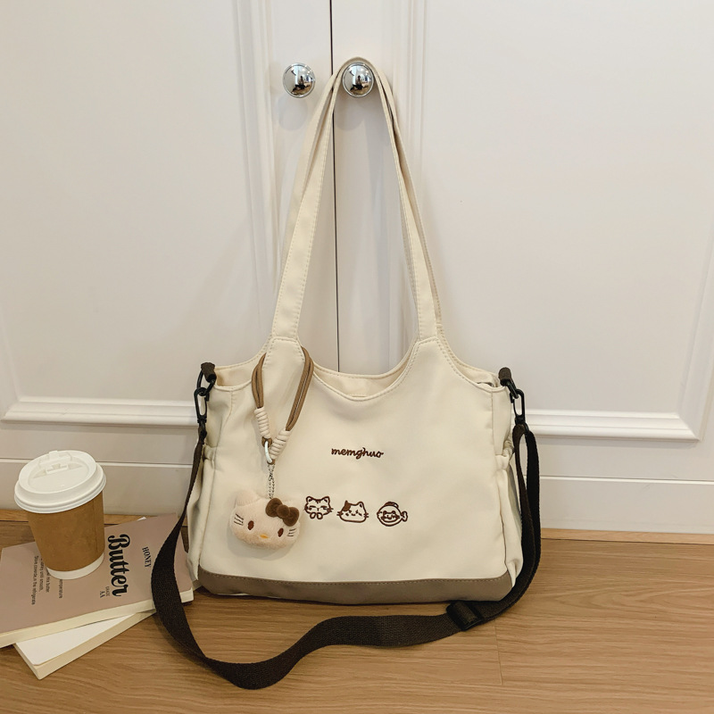 2026 nuevo lindo bolso de tote nicho de moda simple textura de viaje universal mujer gran capacidad mochila de hombro