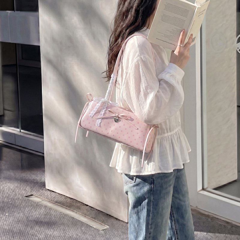 Bolsa de brazo de punto de onda popular de verano para mujeres 2026 nueva moda bolso de palo de viaje bolso de hombro diario