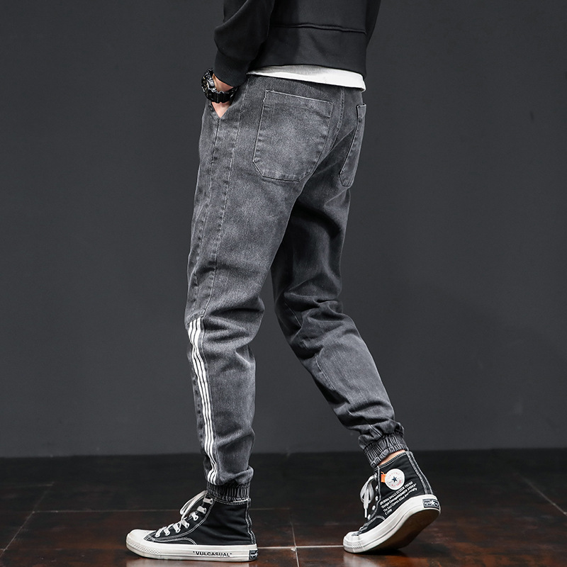 Jeans casuales de cintura elástica sueltos para hombres primavera de moda coreana para hombres, nueve puntos.