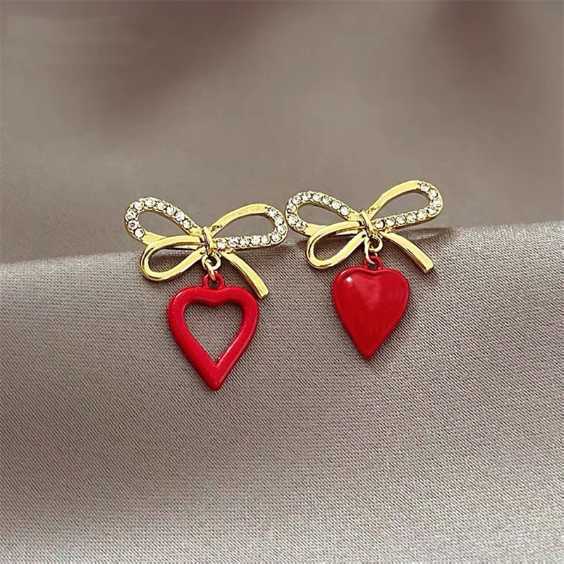 Korean Style Heart Shaped Hollowed Bows Alloy Stud Earrings Wholesale display picture 1