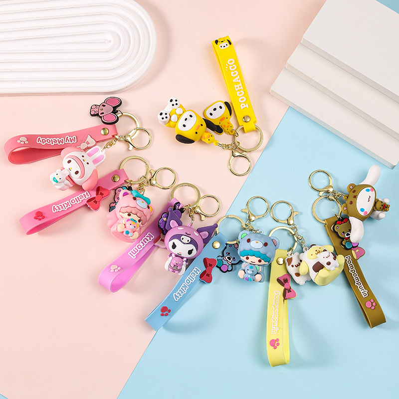 Sanrio sosteniendo pequeño animal llavero muñeca bolsa colgante ciego caja llavero muñeca máquina empuje pequeño regalo al por mayor