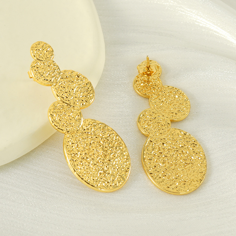 Diseño transfronterizo europeo y americano, pendientes de acero de titanio de moda chapados en oro de 18 quilates de acero inoxidable de lava INS viento