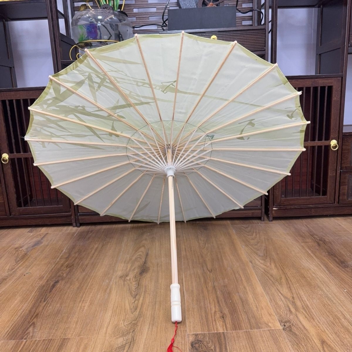 Traditional Chinese style oil paper umbrella with silk fabric print, used for ceiling decoration, photography, dance props, performances, Hanfu fashion shows, and cheongsam fashion shows