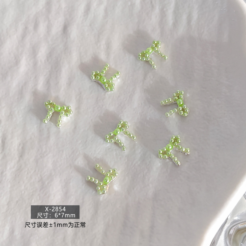 春日甜美简约日韩风珍珠蝴蝶结立体树脂美甲饰品爆款多色系指甲钻|undefined