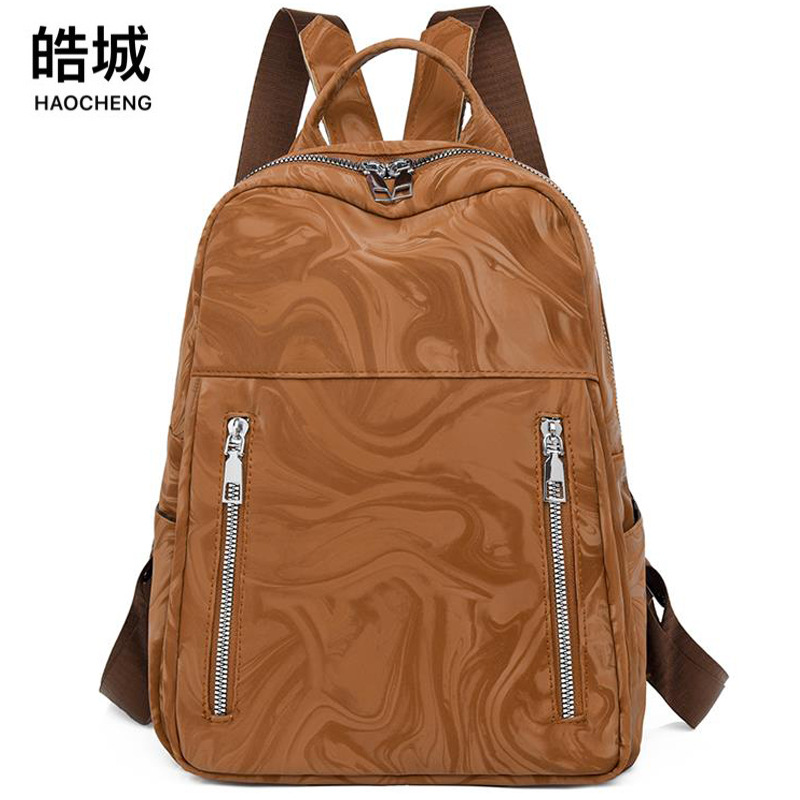 2024 nueva mochila de cuero suave para mujer de alta gama, mochila de viaje de gran capacidad a prueba de agua simple de moda