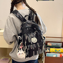 新款书包日系百搭女士双肩包韩版时尚大容量笑脸减负学生背包可爱