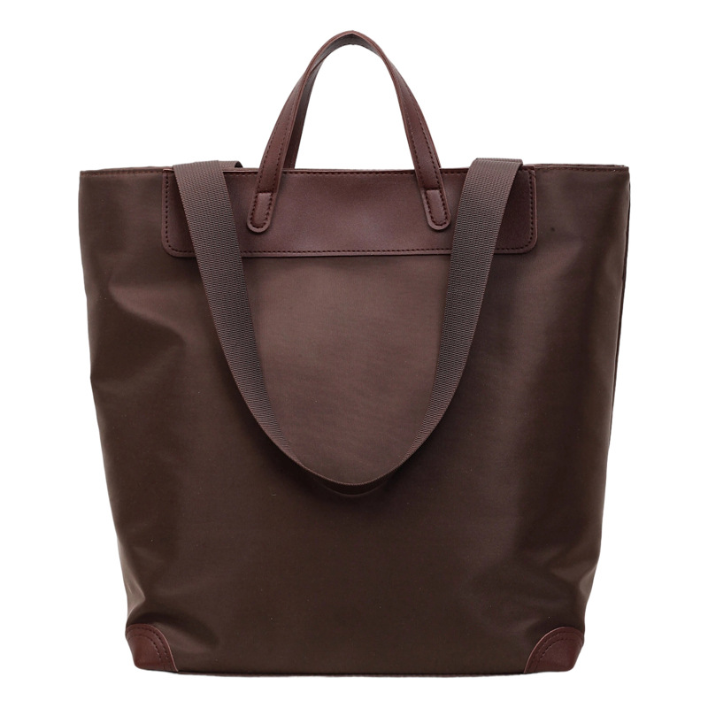 Nuevo estilo coreano de alto valor, bolso de mano casual simple, bolso de hombro de gran capacidad de viaje ligero de tela de nylon.