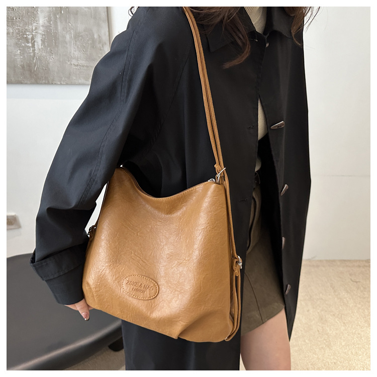 The 2024 new pleated tote bag is a large-capacity casual and fashionable backpack for women, featuring multi-functional texture and a single-shoulder crossbody bag undefined