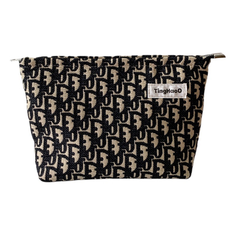 Original Niche Fabric Cosmetic Bag High Color Value Texture Thick and Durable Portable Carry-on Storage Bag European and American Clutch Bag