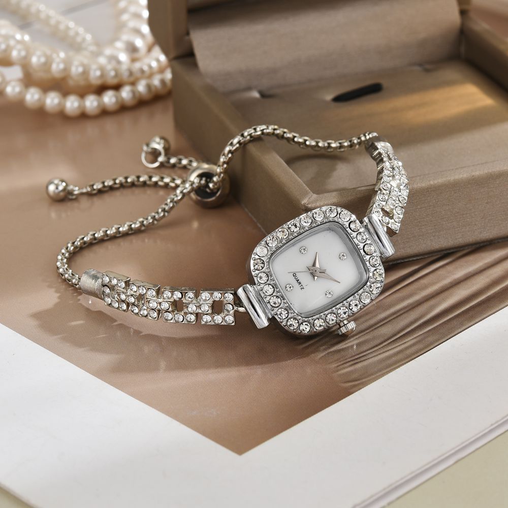 Nueva estudiante de estilo coreano temperamento diseño de cuerda de dibujo pequeño cuadrado con incrustaciones de diamantes temperamento de moda simple reloj de pulsera femenino