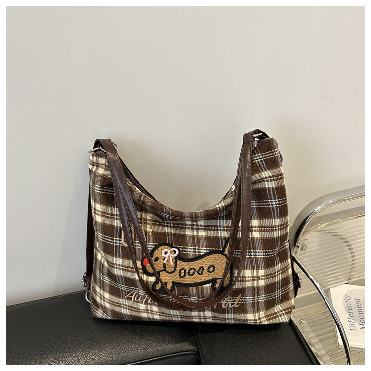 A new 2024 trendy and stylish backpack for women, featuring a cartoon checkered single-shoulder crossbody bag and a tote bag undefined