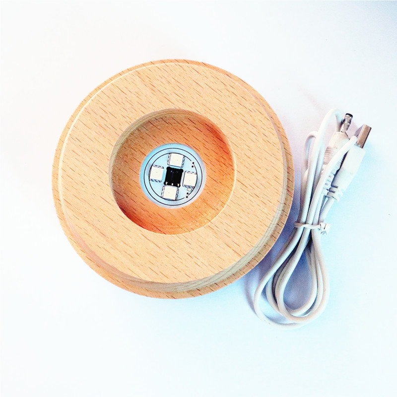 Bola de cristal giratoria caja de música LED base luminosa luz de la noche de dibujos animados pequeña base de la decoración