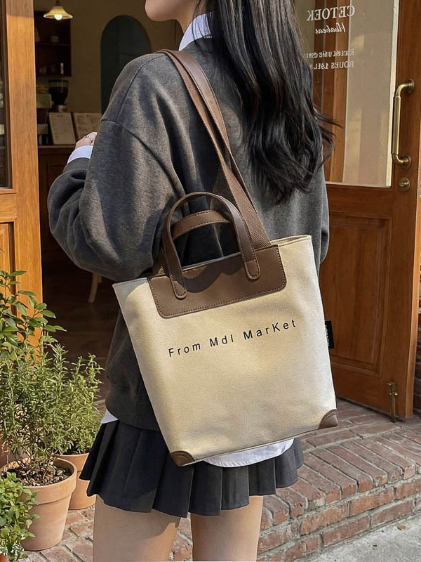 Bolsa de lona coreana hollow-wind casual bolso de mano para mujeres 2026 nueva bolsa de hombro casual simple y lujosa