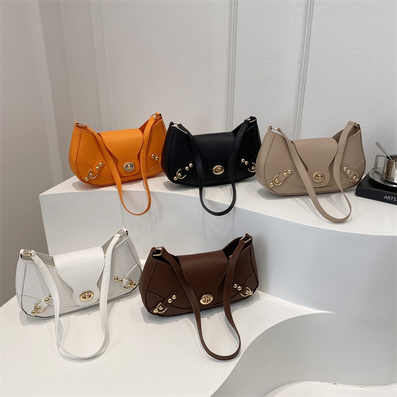 Bolsa de bolinillos retro chica caliente un hombro bolso de mochila para mujeres 2025 nuevo diseño locomotora de cierre de viento bolso de brazo