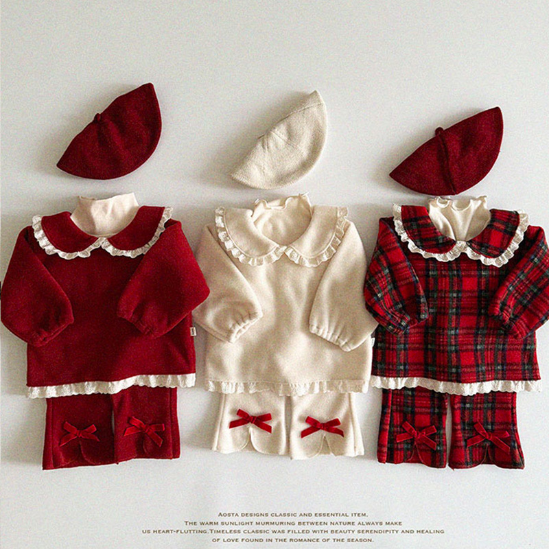 Ropa de invierno de niñas ropa infantil coreana ropa de invierno infantil ropa de invierno de bebé gran arco y camisa de cordillera de lana