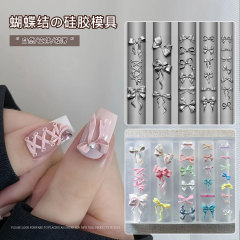 赤い本の爆発的なネイルアートのレリーフ金型3dシリコンゴム金型の氷の花の漫画の蝶結びのリボンの立体の鋳型の卸売り