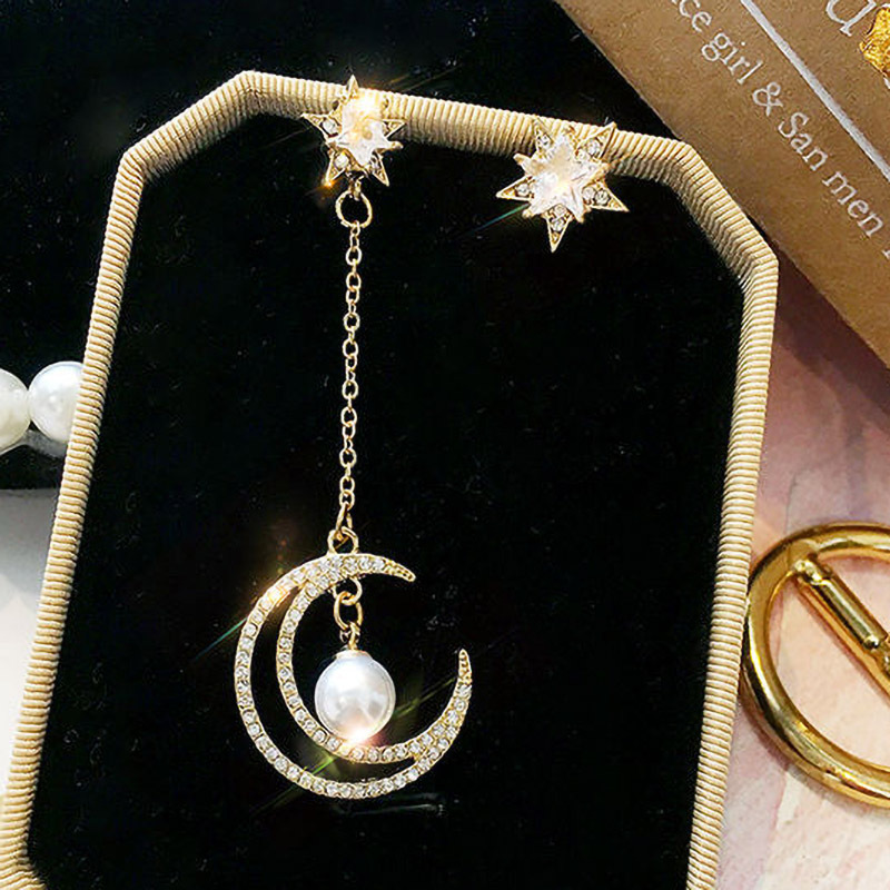 Asymmetrical long earrings with tassels