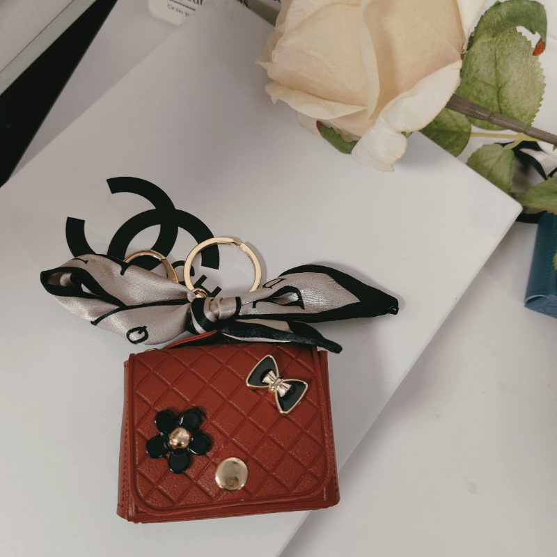 Nuevo estilo transfronterizo, moderno y exclusivo mini bolso acolchado tipo colgante, monedero para llaves, accesorio para auriculares.