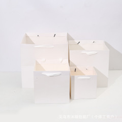 旧正月の四角い袋の正方形の手提げ紙袋クラフト紙の正方形のギフト袋の紙袋のバレンタインデーは贈り物の卸売りを送ります。