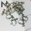 A pair of threaded white K ear clips